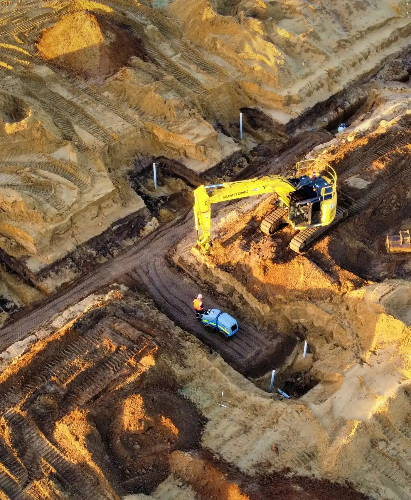 Excavator loading at an open pit